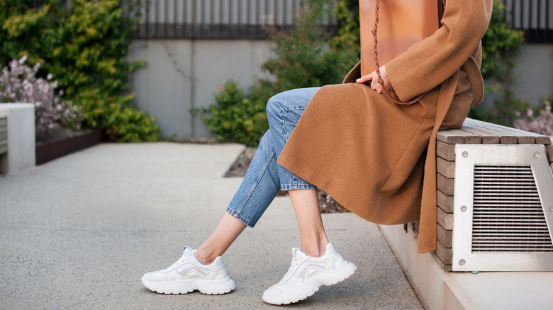 Woman wearing white sneakers 