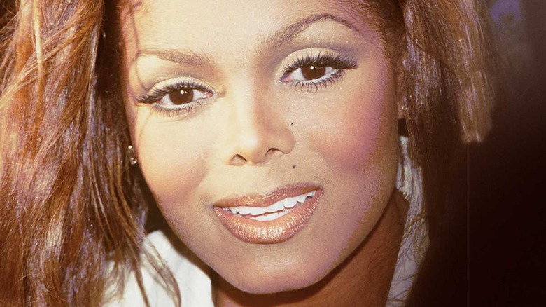 Glamorous Janet Jackson grinning 