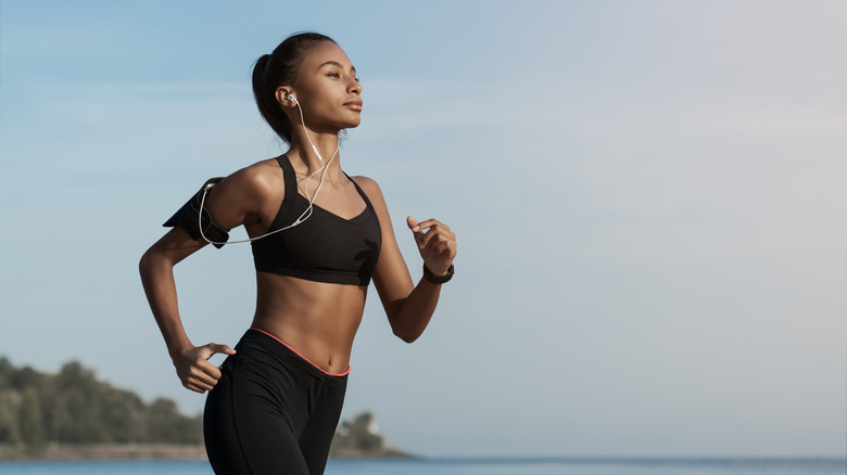 Woman works out while listening to music