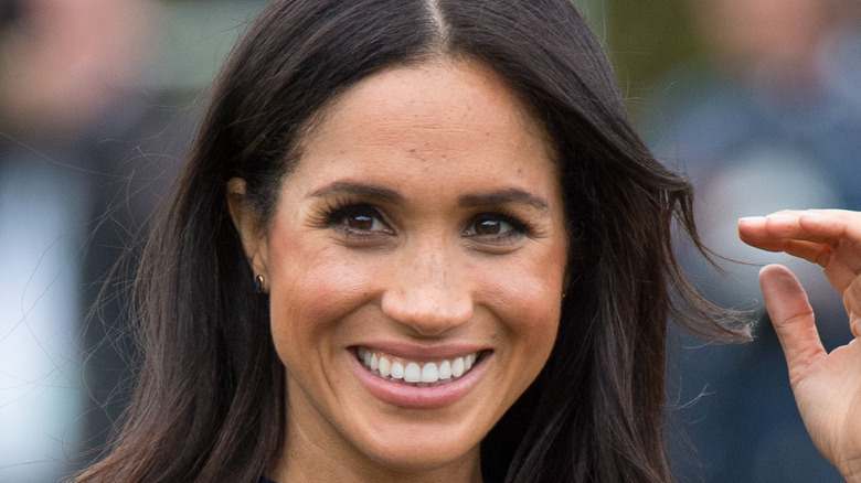 Meghan Markle smiling for photo