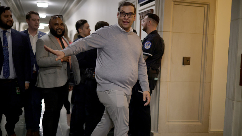 George Santos fending off people trying to talk to him