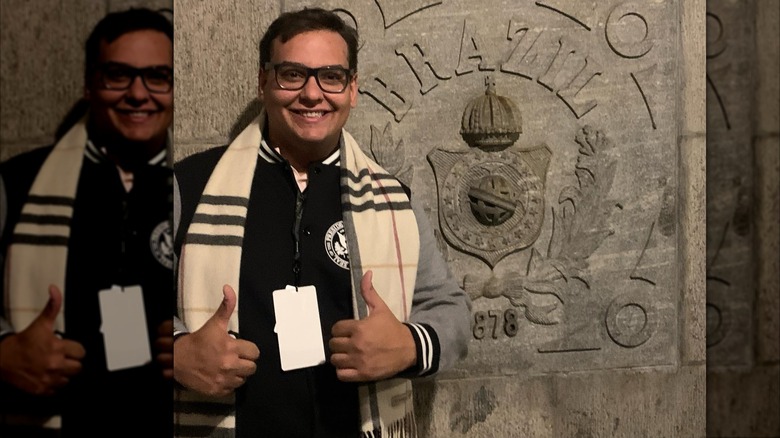 George Santos looking serious and talking