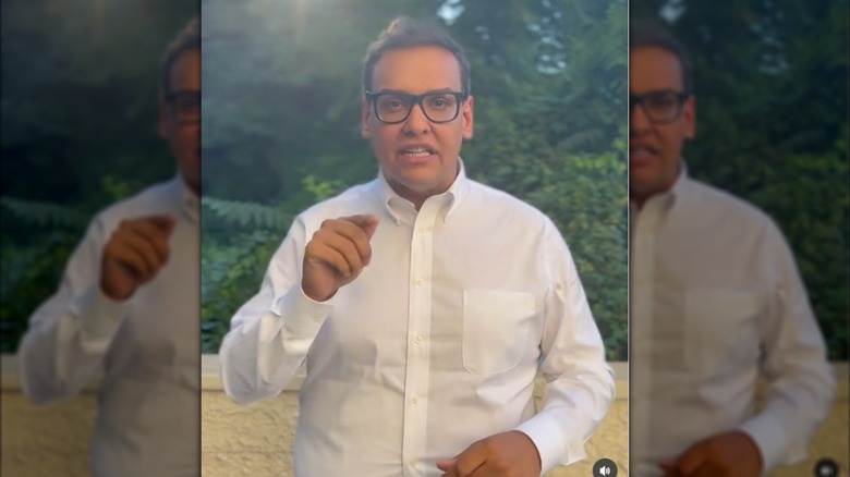 Geroge Santos pointing and talking