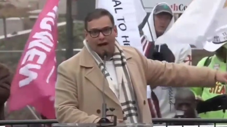 George Santos talking and gesturing