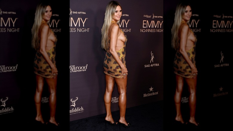 Heidi Klum posing in an animal-print dress at the Hollywood Reporter and SAG-AFTRA's 5th Annual Emmy Nominees Night