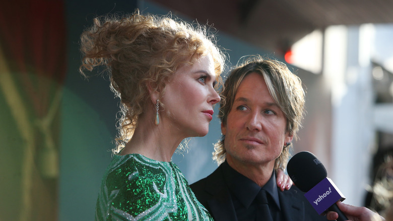 Keith Urban looks at Nicole Kidman during an interview