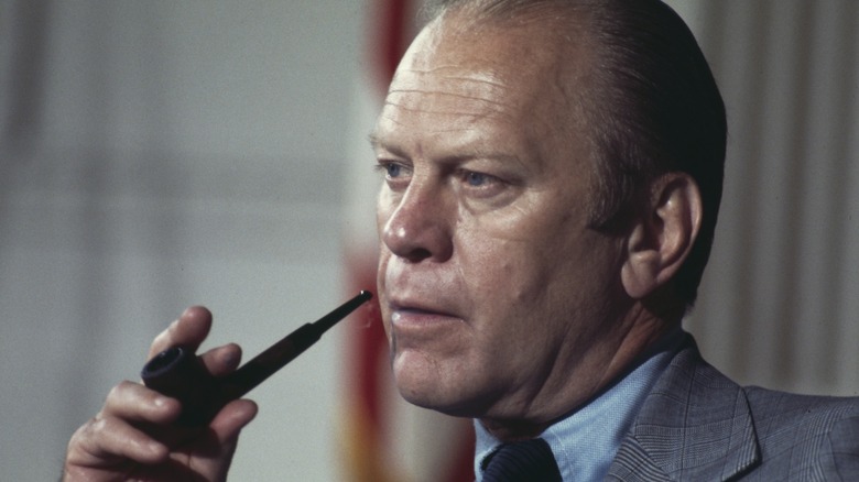 Gerald Ford puffing on a pipe