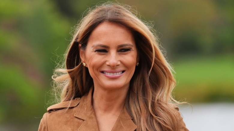 A smiling Melania Trump visiting the U.K. in 2025