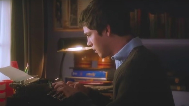 Logan Lerman typing in The Parks of Being a Wallflower