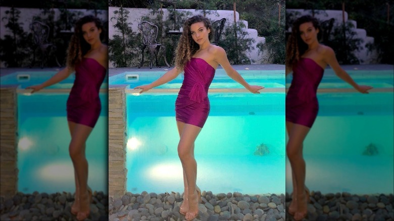 Sofie Dossi in a dress by the pool
