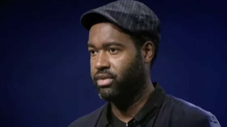 Emilio Sosa wearing hat on "Project Runway" Season 7, Episode 12.