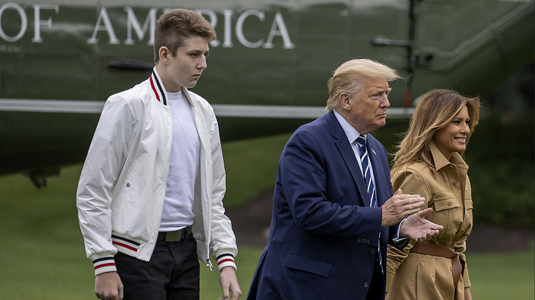 Barron Trump walking next to his parents Donald and Melania Trump