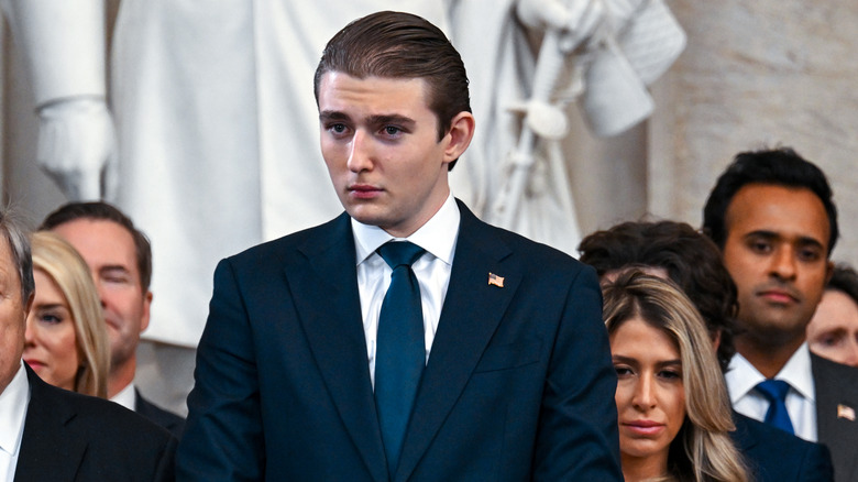 Barron Trump looking serious in a suit at Donald Trump's inuguration