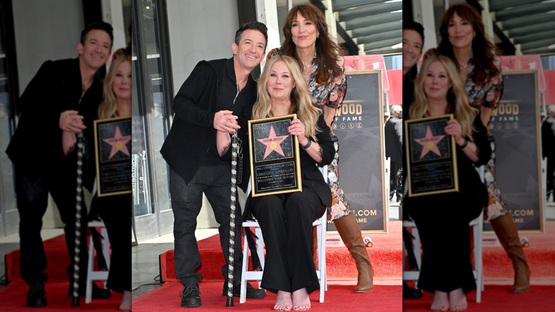 Christina Applegate holding a cane and posing with Katey Sagal and David Faustino while getting her Hollywood Walk star