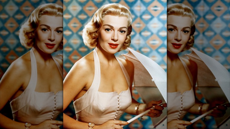Lana Turner holding an umbrella