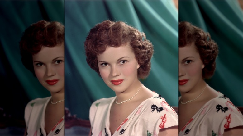 Shirley Temple posing for a photo