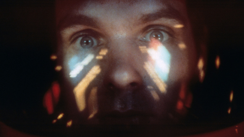Keir Dullea with lights reflecting in front of his face from '2001: A Space Odyssey'