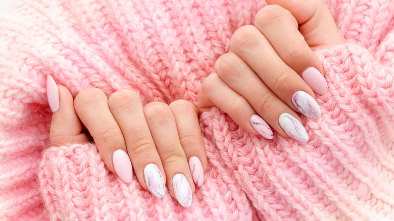 Pink sweater, pink nail polish