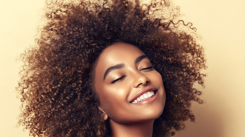 woman with curly black afro hairstyle