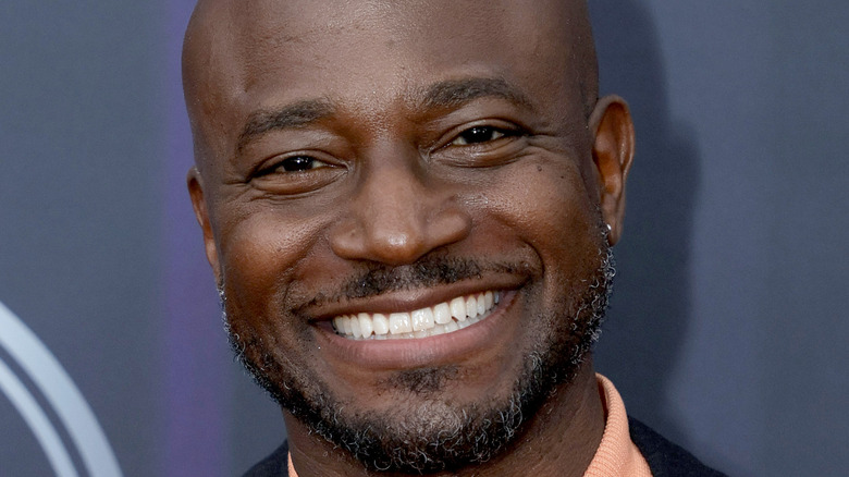 Taye Diggs smiling and pointing