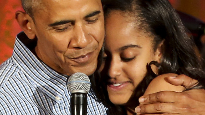 Barack Obama hugs Malia Obama