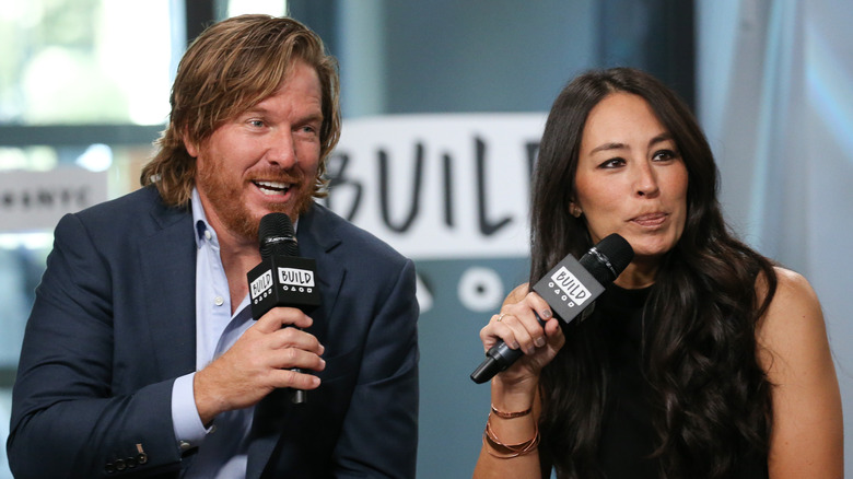 Chip and Joanna Gaines speaking at an event
