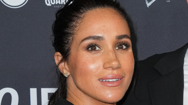 Closeup of Meghan Markle with her hair pulled back