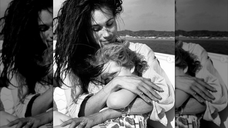 Meghan Markle holding Princess Lilibeth