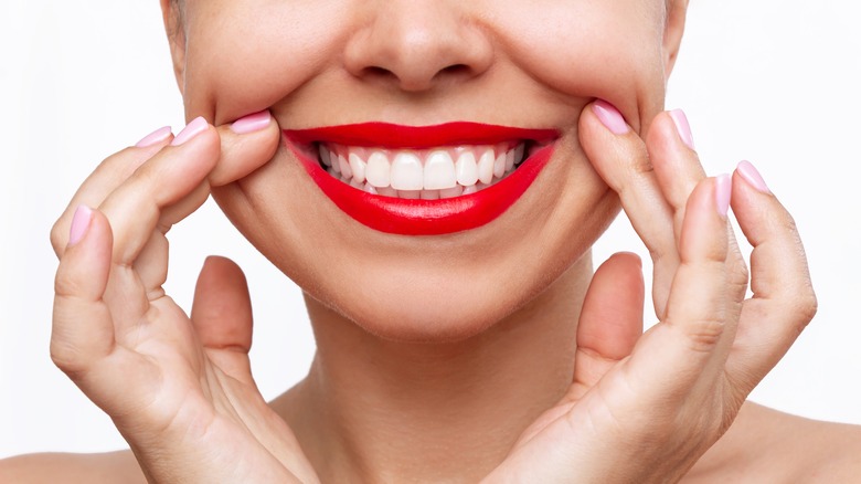 Woman smiling in bright red lipstick 