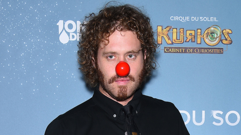 T.J. Miller wearing a red clown nose on the red carpet
