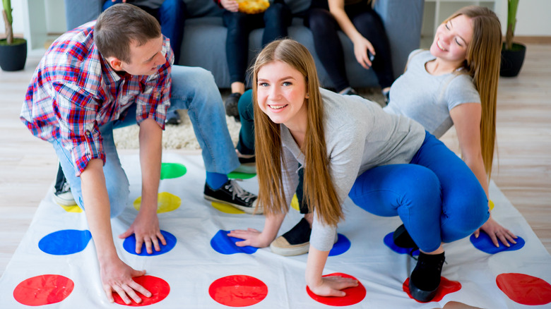 A group of people playing Twister