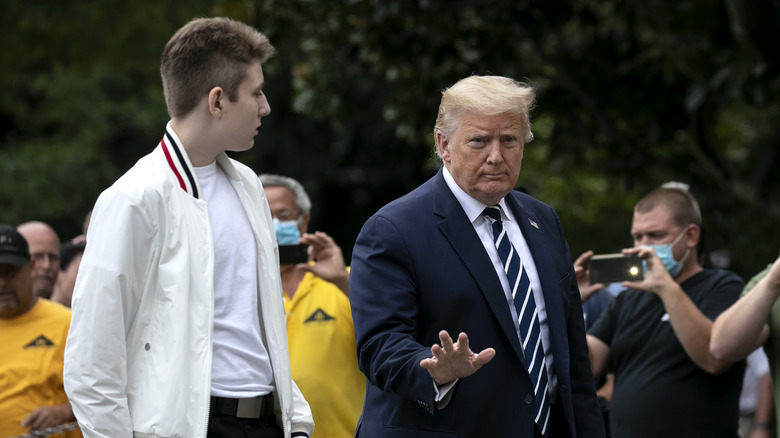 Barron and Donald Trump walking together 