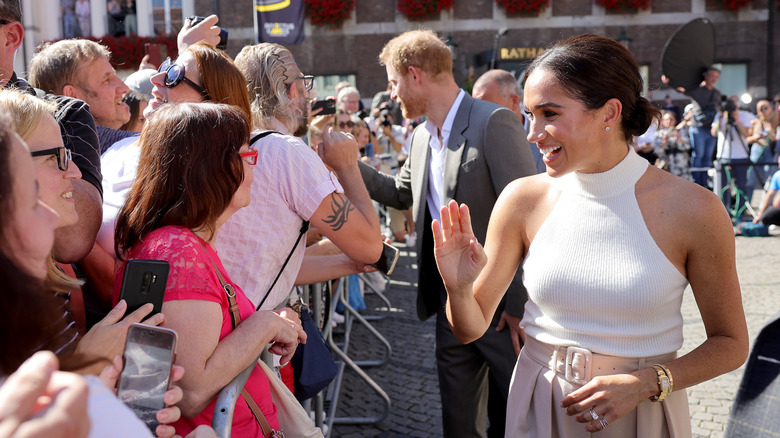 Harry and Meghan with crowds 