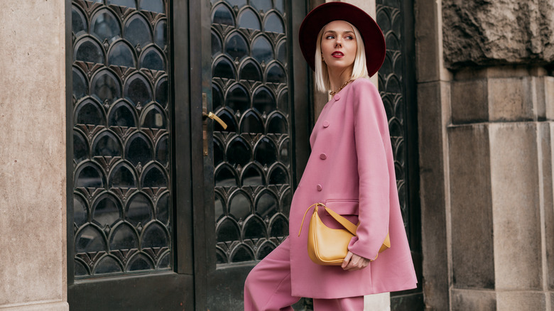 Woman in pink suit