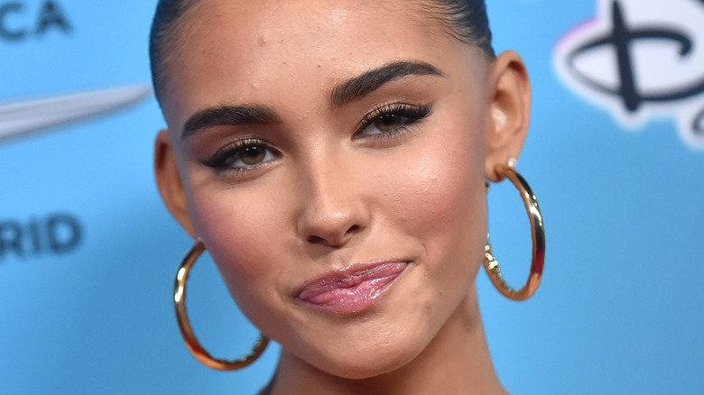 Madison Beer smiling at a formal event