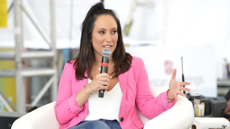 Cheryl Burke speaks at an event.