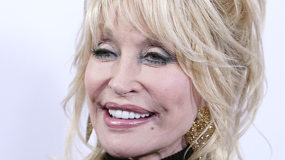 Dolly Parton smiles at an event