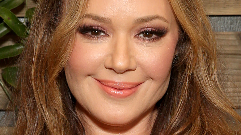 Leah Remini poses with her award