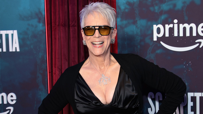 Jamie Lee Curtis wearing sunglasses and smiling