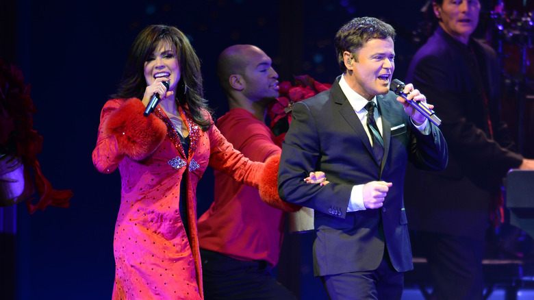 Donny and Marie perform onstage together 