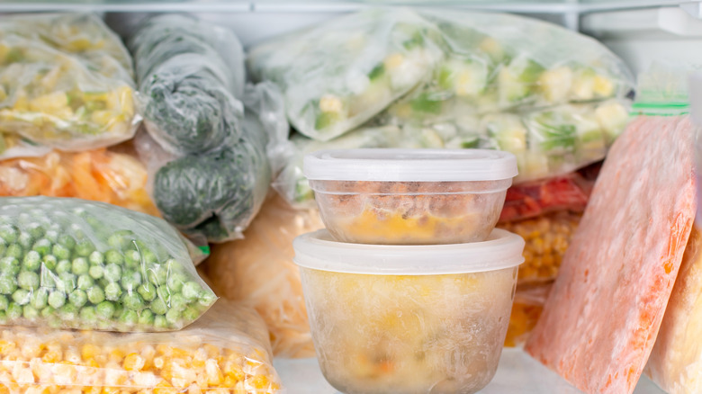 Produce and food stacked in a freezer 