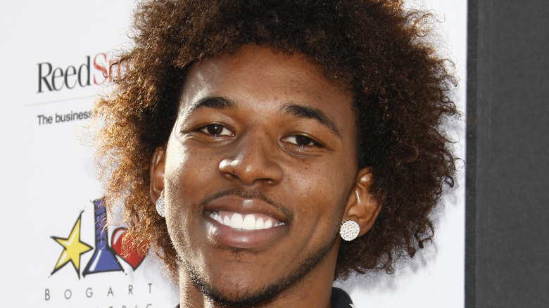 Nick Young smiles on the red carpet