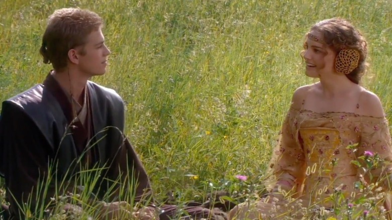 Anakin and Padme chill in a field in Attack of the Clones