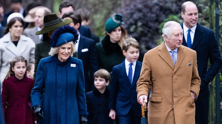 Queen Camilla and King Charles walking with Cambridges