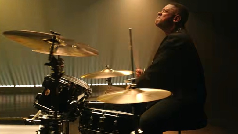 Matt Sallee playing the drums in a music video
