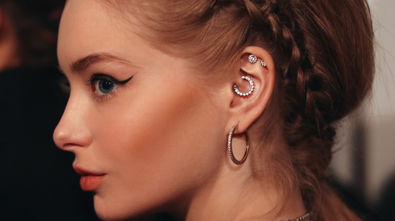 Woman with ear piercings