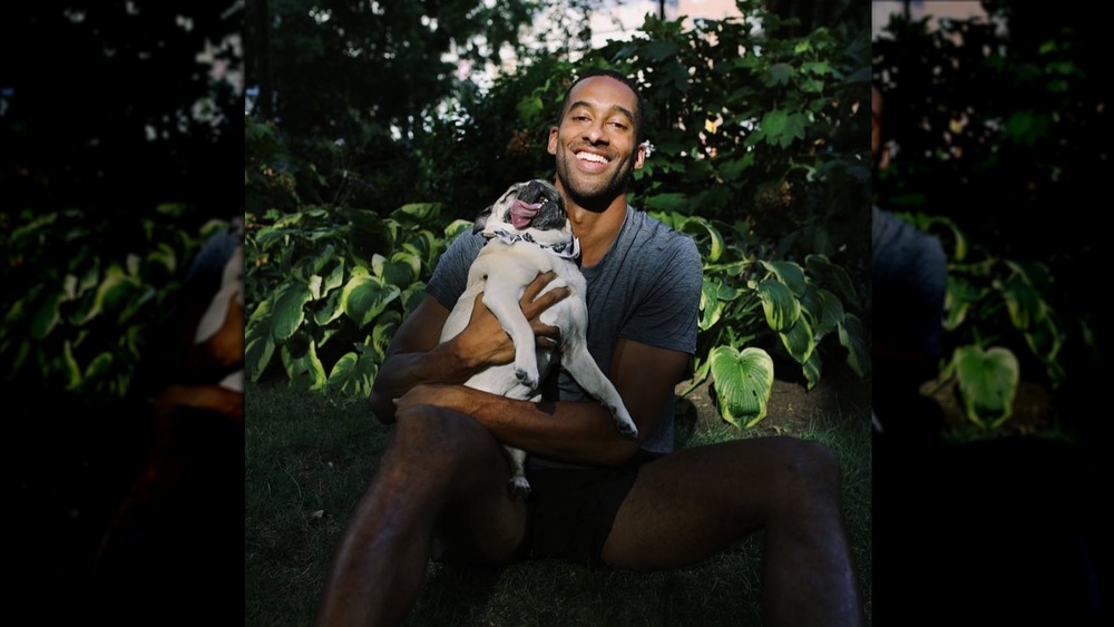 Matt James snuggles with his pug 