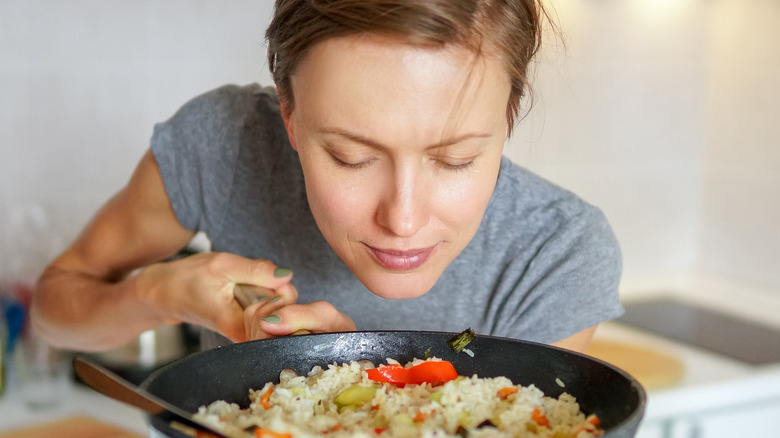 Woman smelling food