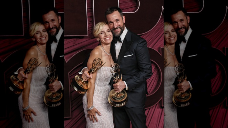 Noah Wyles and Sara Wells pose together with Wyle holding two Emmy awards.