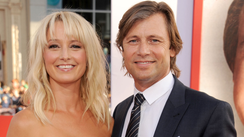 Katherine LaNasa and Grant Show smiling at the Los Angeles premiere of "The Campaign" in 2012